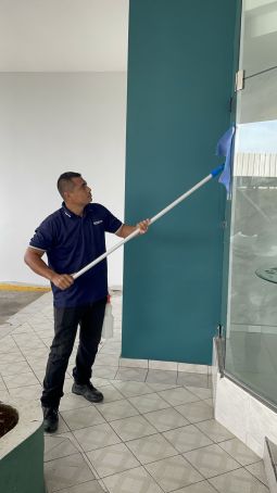 Broomday Texas LLC janitor in Austin, TX mopping floor.